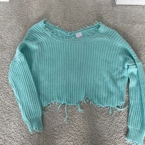 “Ripped” look cropped sweater.